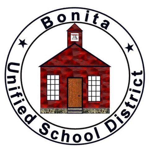 district emblem with school house within a circle 